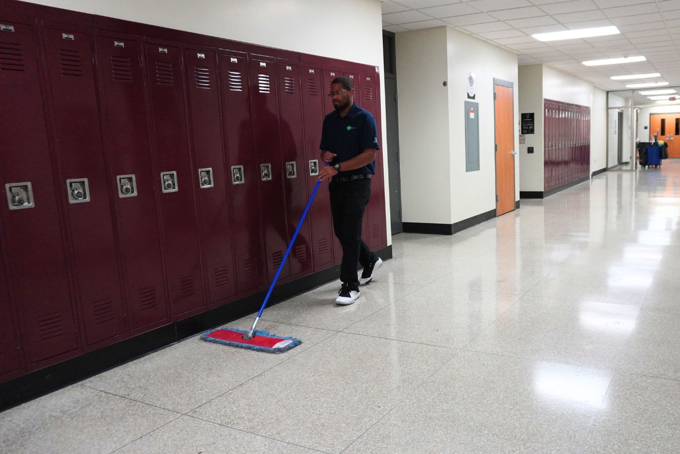 Our school cleaning company staff in Milwaukee, Wisconsin, cleans classrooms to ensure student safety.