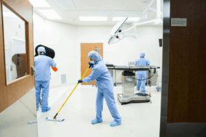 Robotic floor scrubber cleaning hospital hallway in Salt Lake City healthcare facility with KleenMark medical cleaning team.